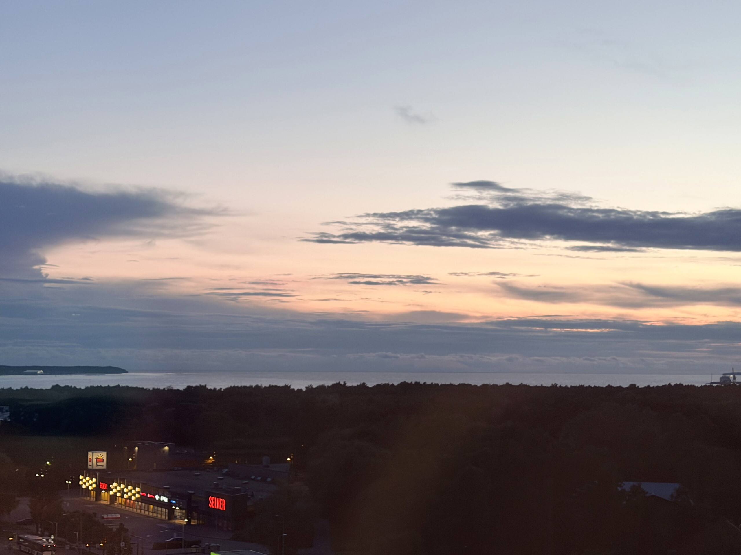 Looking out along the balcony rail toward the horizon.