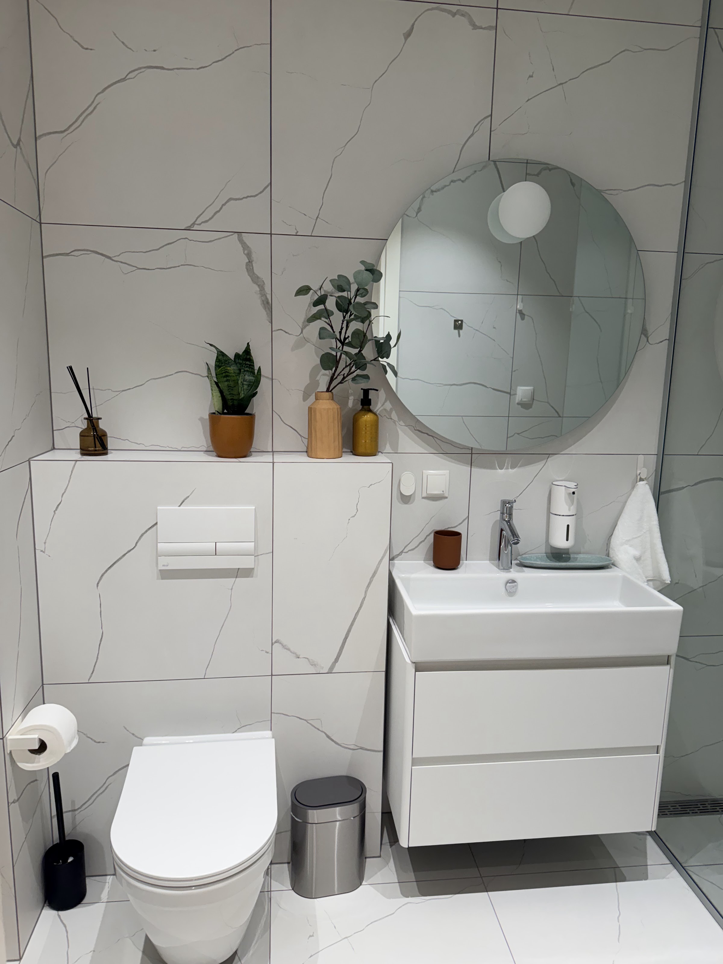 Washer and dryer in the bathroom utility corner.
