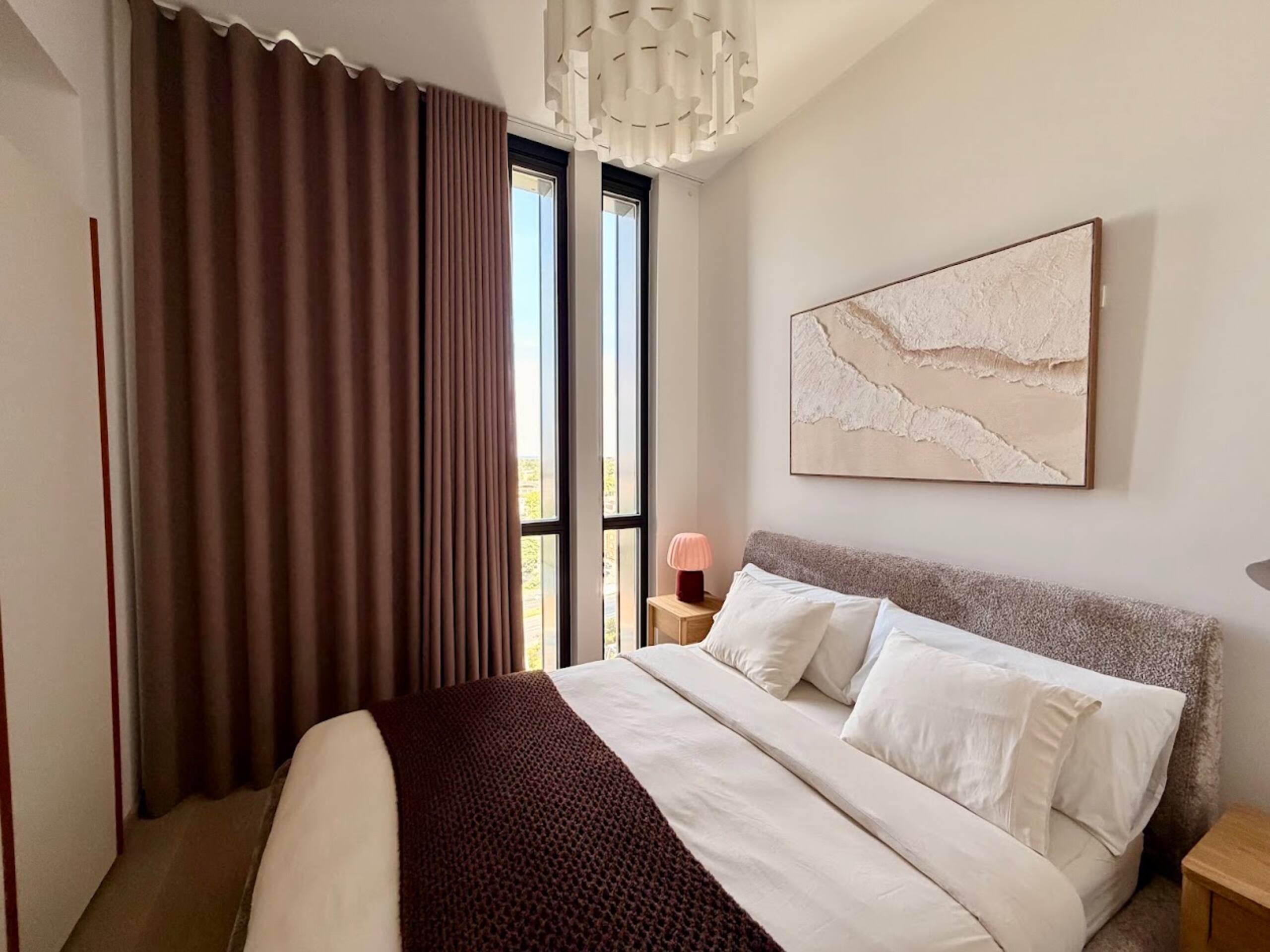 The master bedroom with the double bed made up in cotton linens.