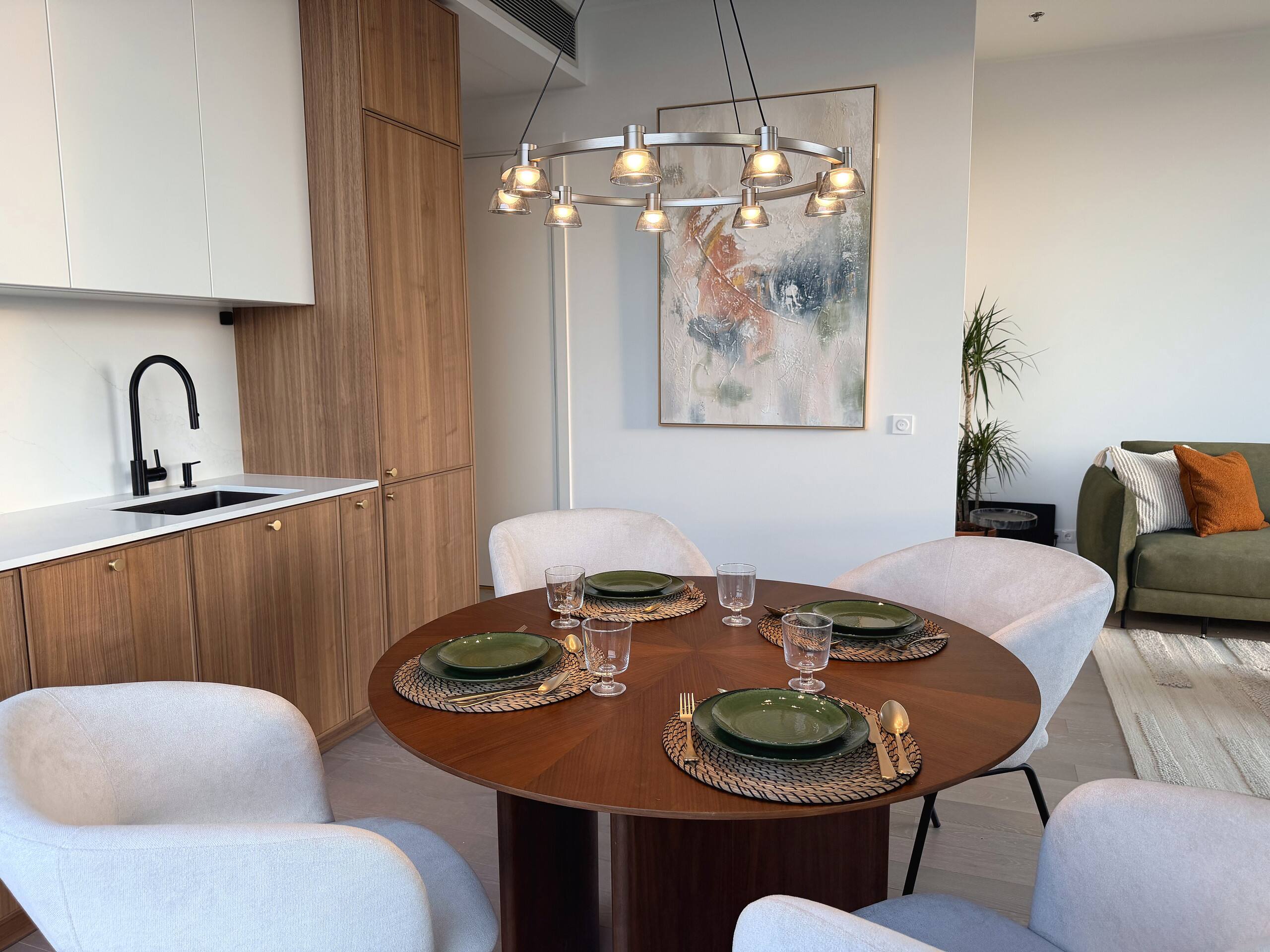 Dining table set for four beside the window.